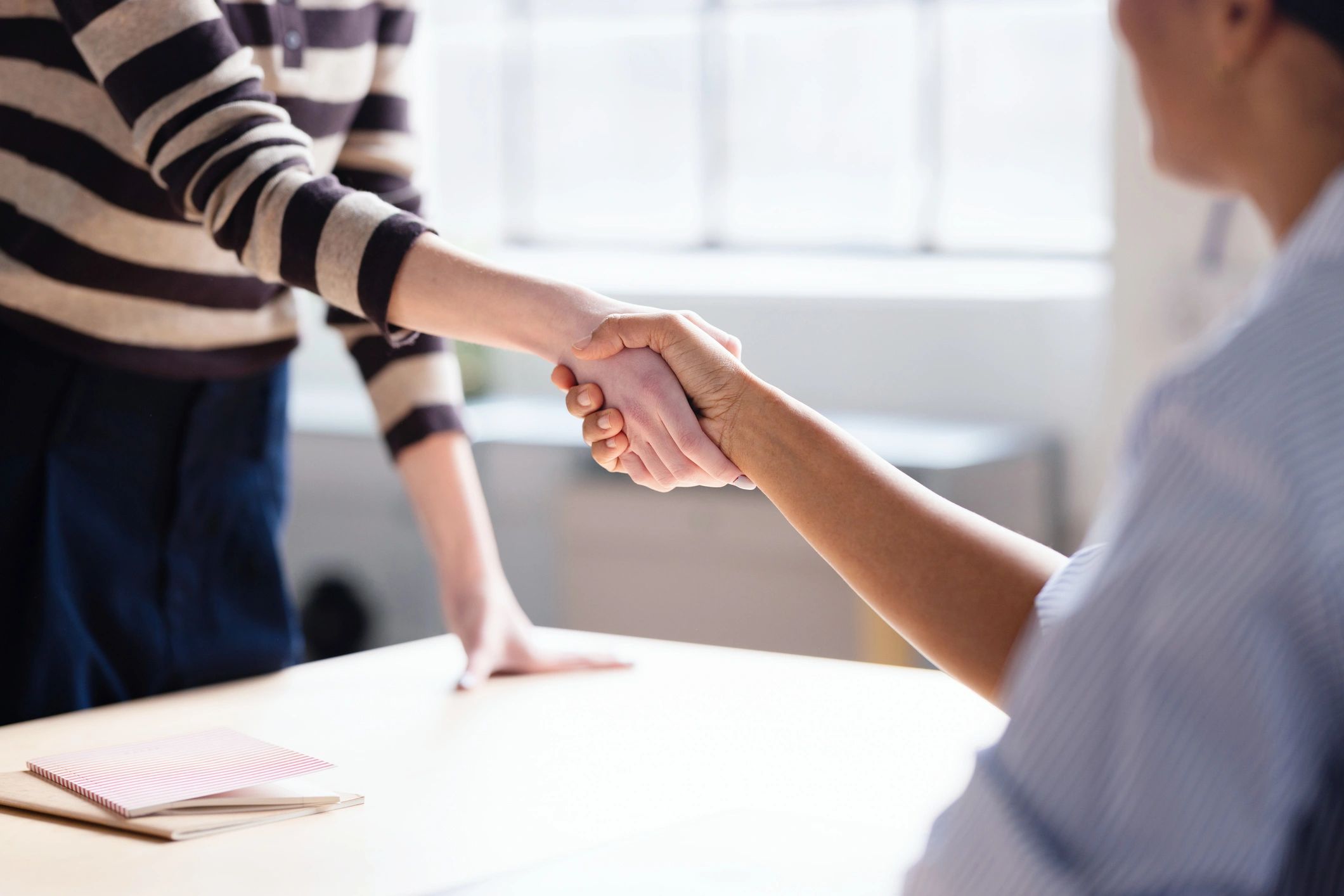 Professional business handshake representing trusted retail partnerships
